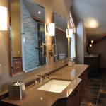 The Colorado master bath retreat AFTER shows a close up of one of the client's vanities.  The mirrors float off the wall surface and the 