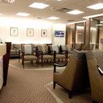 The waiting area of Tulsa OBGYN has custom design seating and upholstery all to complement the architectural curves of the waiting area and the reception desk.  The colors are fresh and warm and the lighting is crisp.